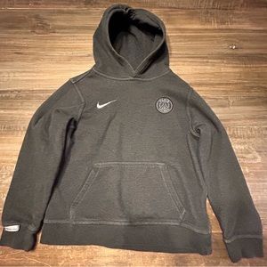 Dark grey nike PSG sweatshirt. Tag says youth large but fits as a youth medium.